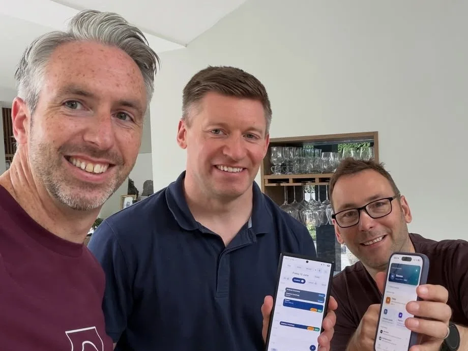 John, Andrew and Ryan, the ResNeo founders, holding up the ResNeo app